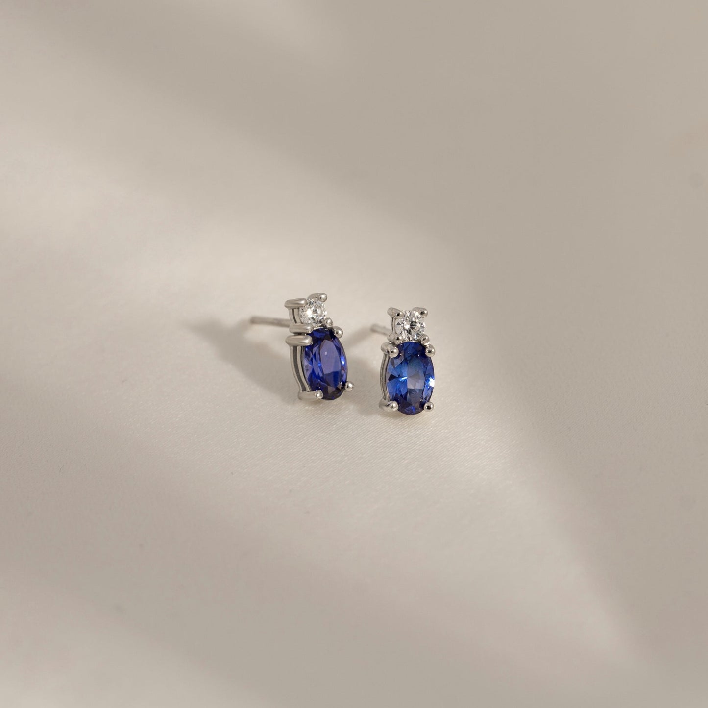 Oval Cut Created Sapphire And Lab Grown Diamond Two Stones Stud Earrings