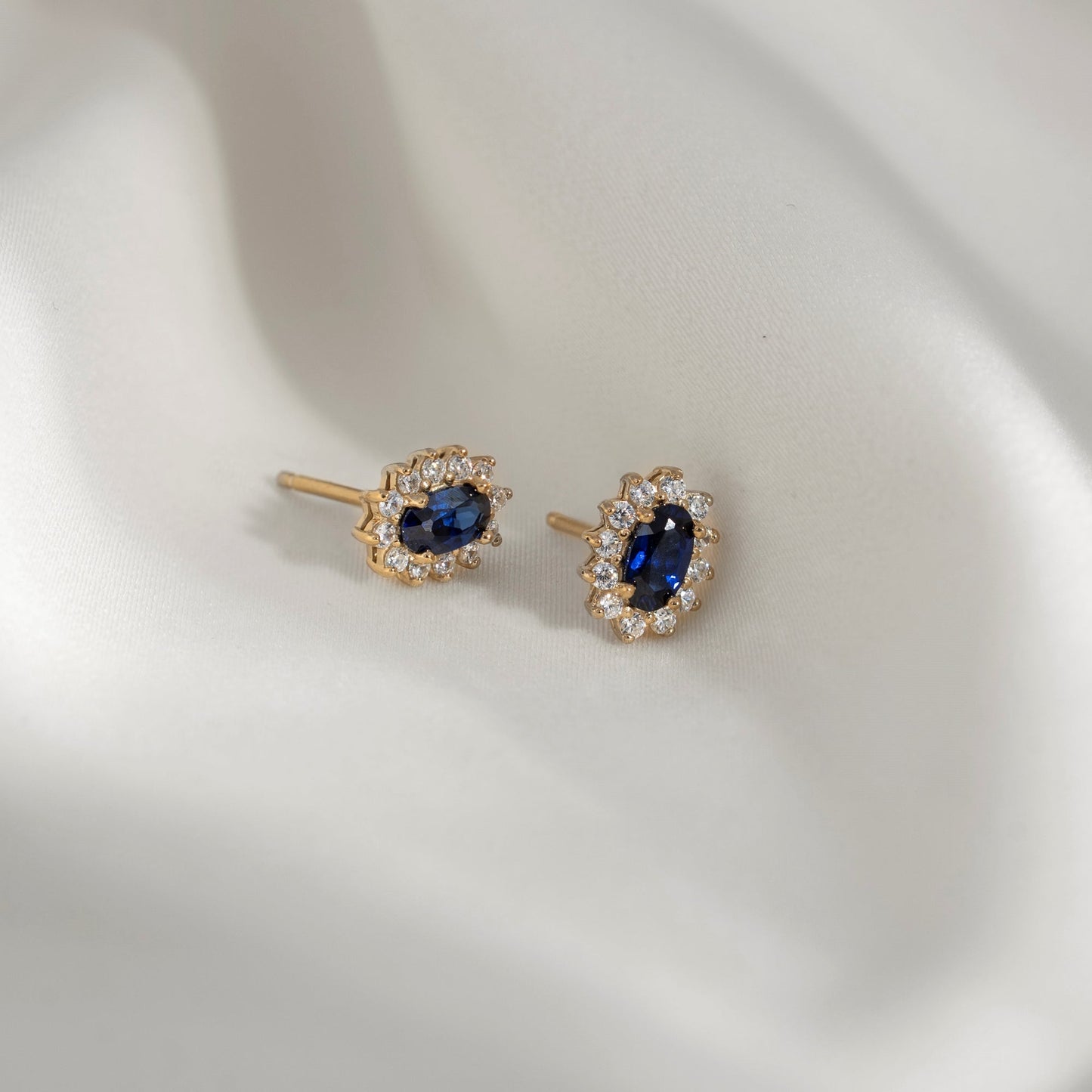 Oval Cut Created Sapphire With Lab Grown Diamond Accent Halo Stud Earrings