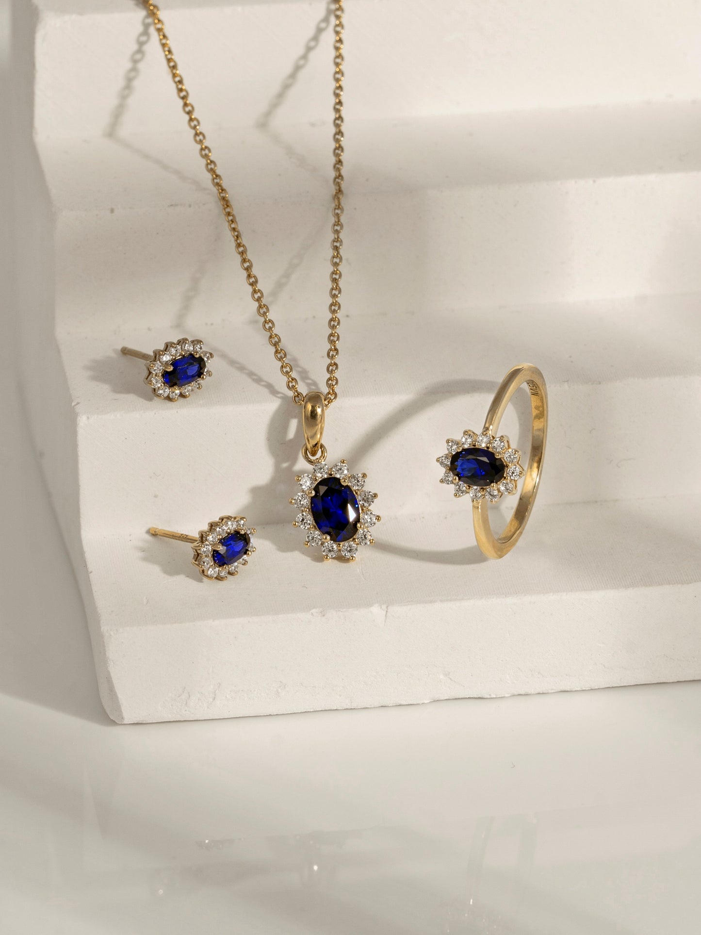 Oval Cut Created Sapphire With Lab Grown Diamond Accent Halo Stud Earrings