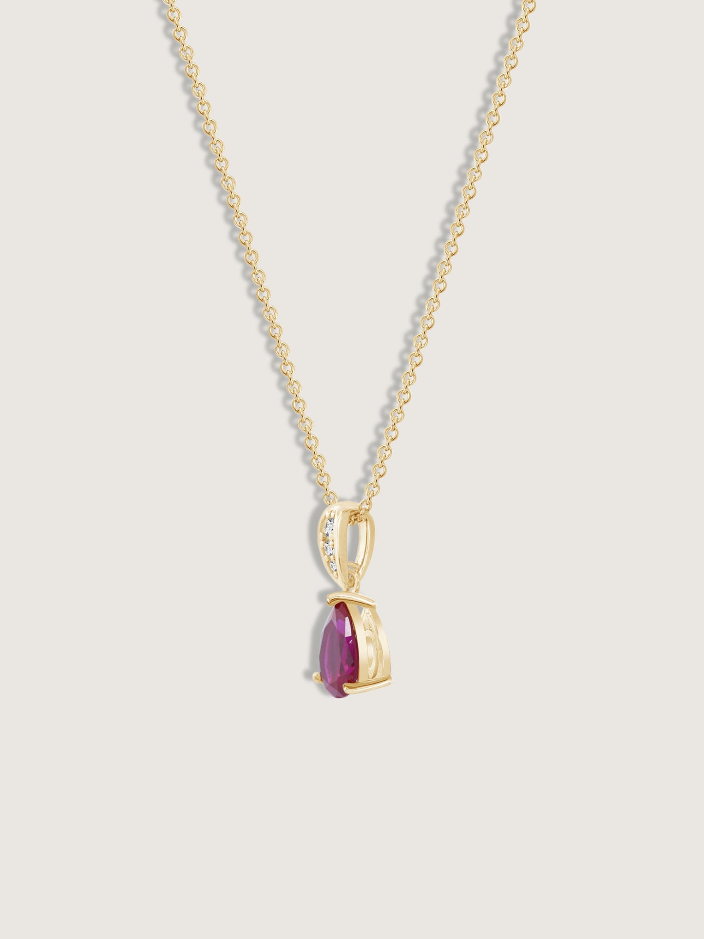 Pear Cut Created Ruby With Lab Grown Diamond Accent Pendant Necklace