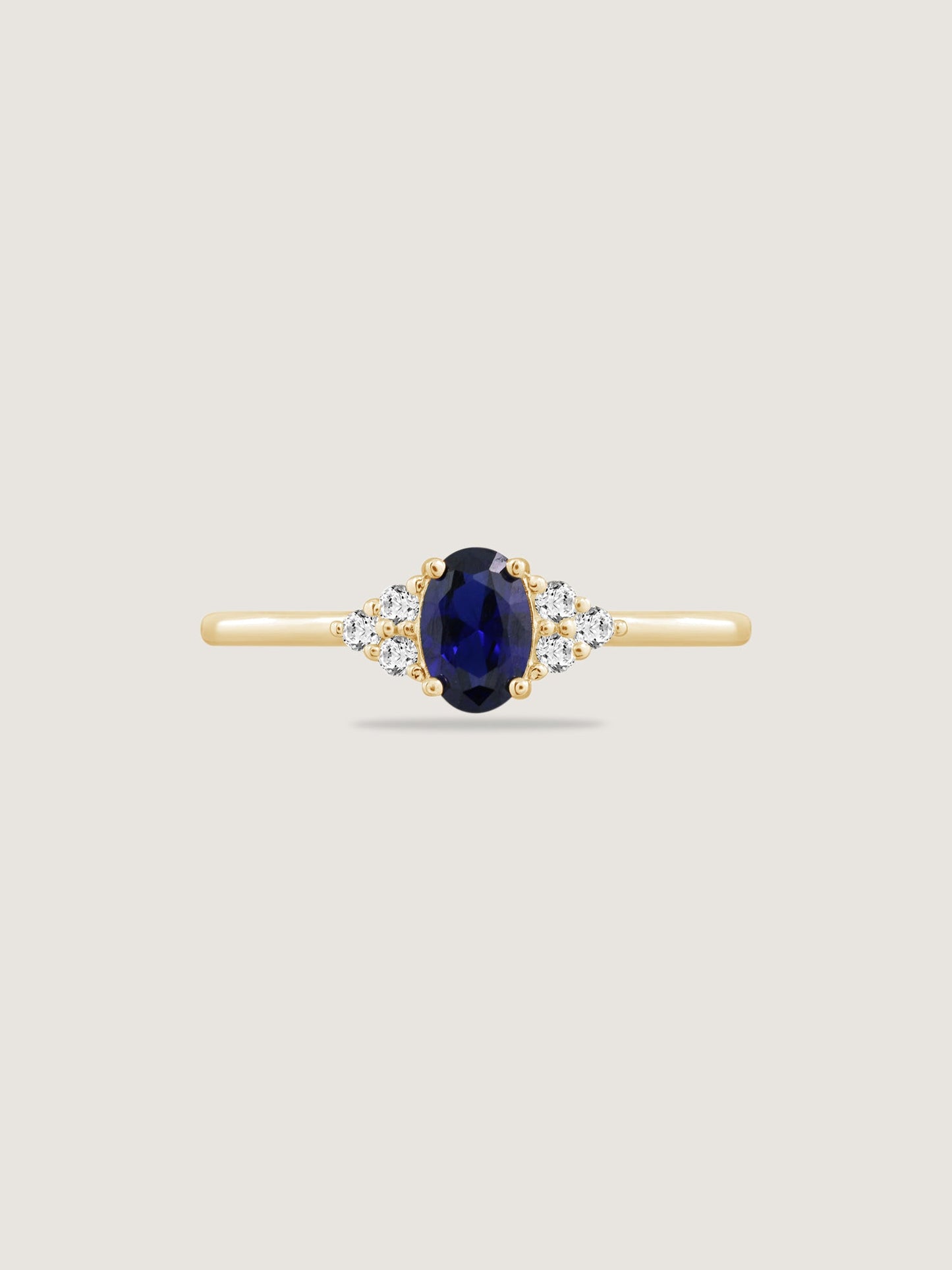 Oval Cut Created Sapphire With Trio Lab Grown Diamond On Shank Engagement Ring