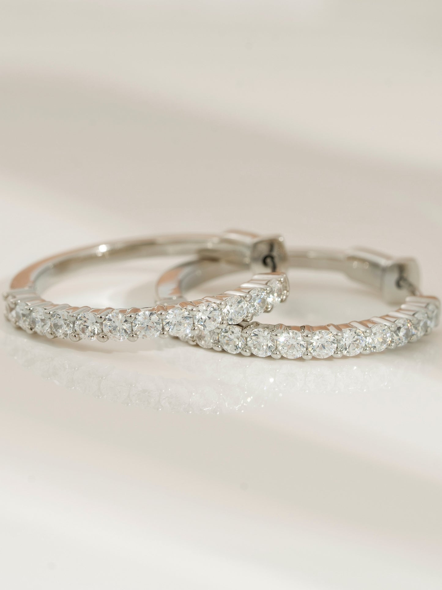 DIAMONBLISS Silver-tone Brass Hoop Earrings| Embellished with Swarovski® Zirconia|  1.5'' outer diameter| 2 cttws