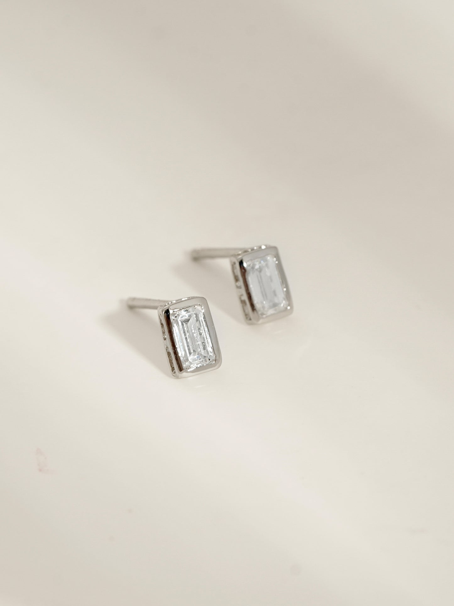 DIAMONBLISS Silver-tone Brass Emerald cut Solitaire Stud Earrings| Embellished with Swarovski® Zirconia| 0.5 cttws