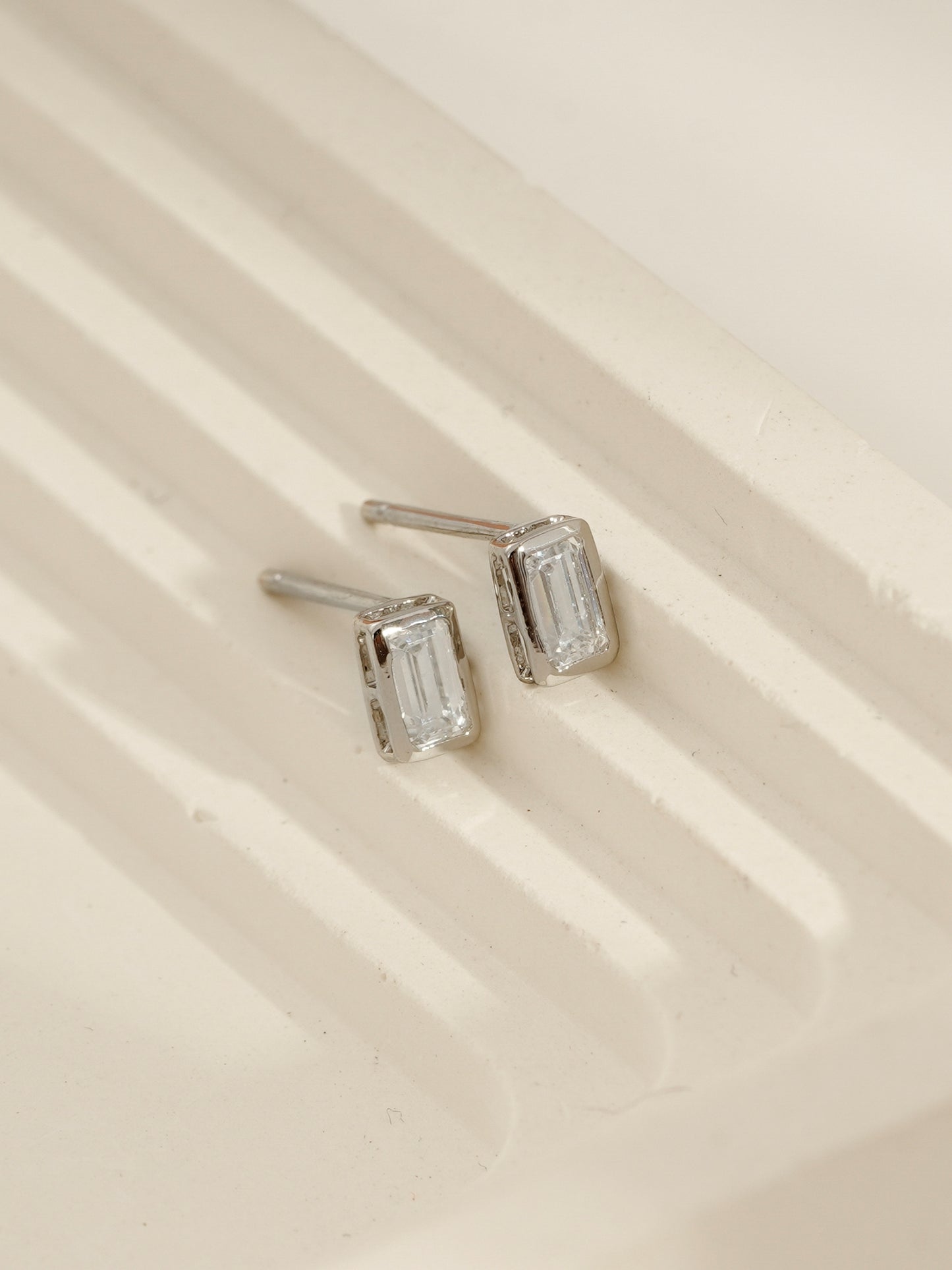 DIAMONBLISS Silver-tone Brass Emerald cut Solitaire Stud Earrings| Embellished with Swarovski® Zirconia| 0.5 cttws