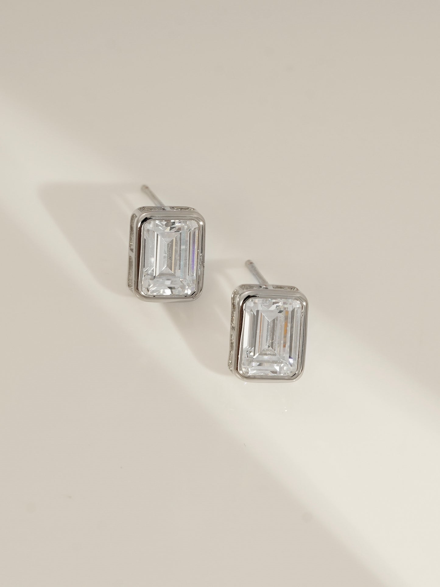 DIAMONBLISS Silver-tone Brass Emerald cut Solitaire Stud Earrings| Embellished with Swarovski® Zirconia| 3 cttws
