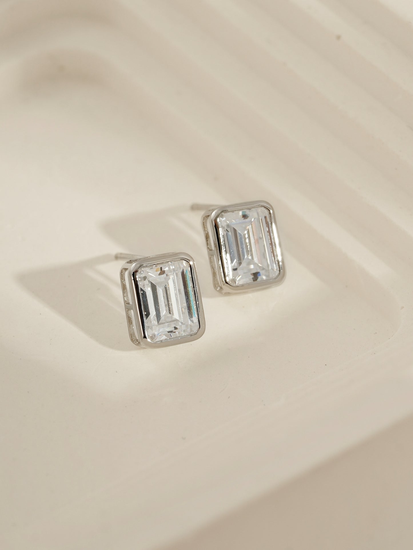 DIAMONBLISS Silver-tone Brass Emerald cut Solitaire Stud Earrings| Embellished with Swarovski® Zirconia| 3 cttws