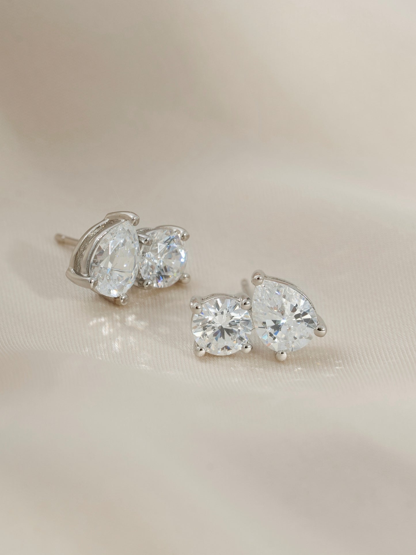 DIAMONBLISS Silver-tone Brass Pear and Round Toi et moi Stud Earrings| Embellished with Swarovski® Zirconia| 4 cttws