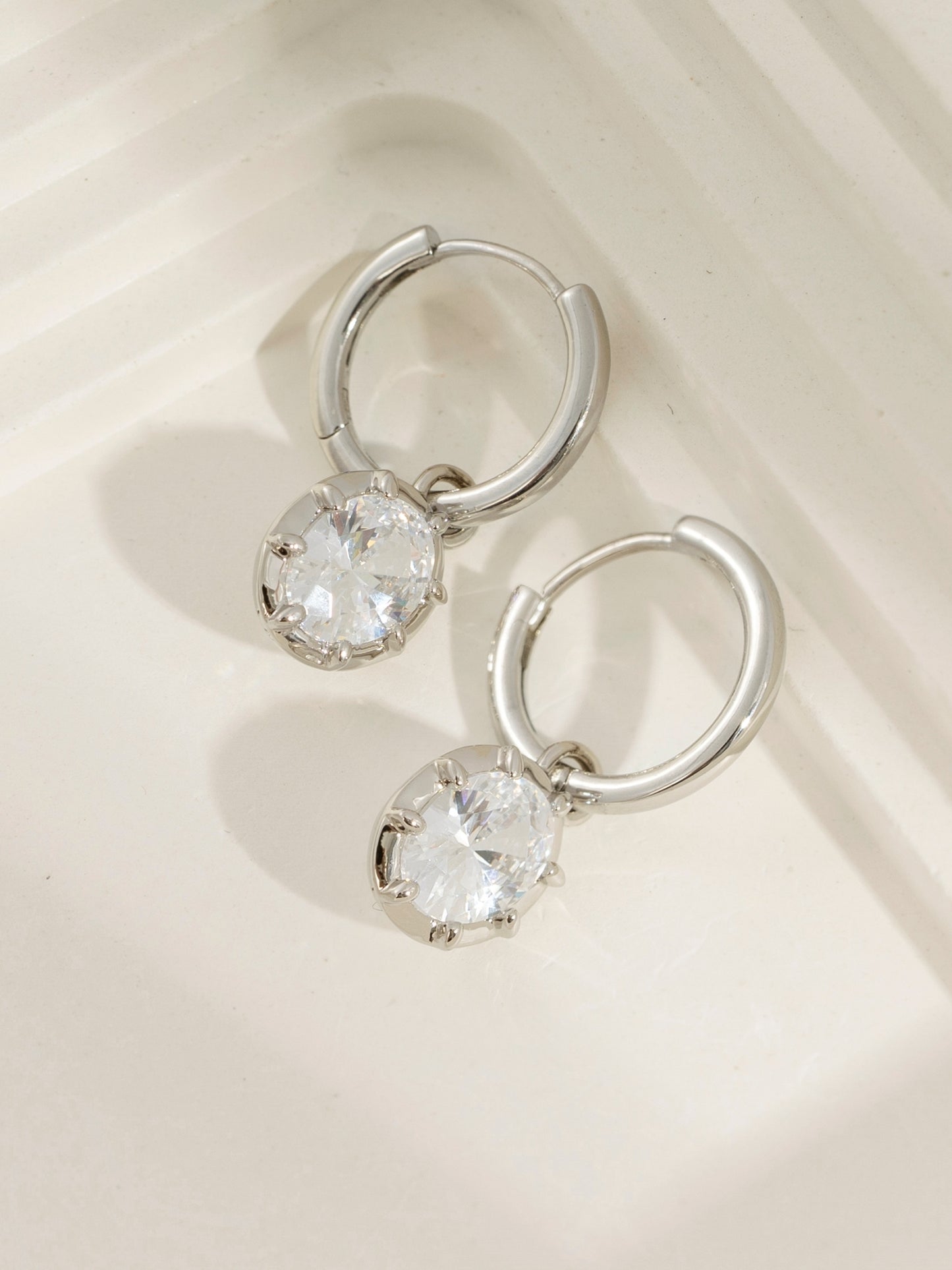 DIAMONBLISS Silver-tone Brass Bezel Oval cut Drop Earrings| Embellished with Swarovski® Zirconia| 3 cttws