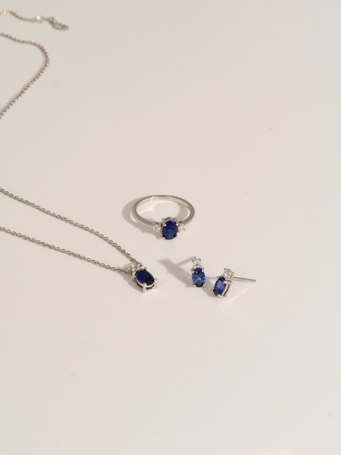 Oval Cut Created Sapphire And Lab Grown Diamond Two Stones Stud Earrings