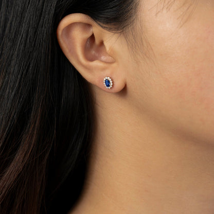 Oval Cut Created Sapphire With Lab Grown Diamond Accent Halo Stud Earrings