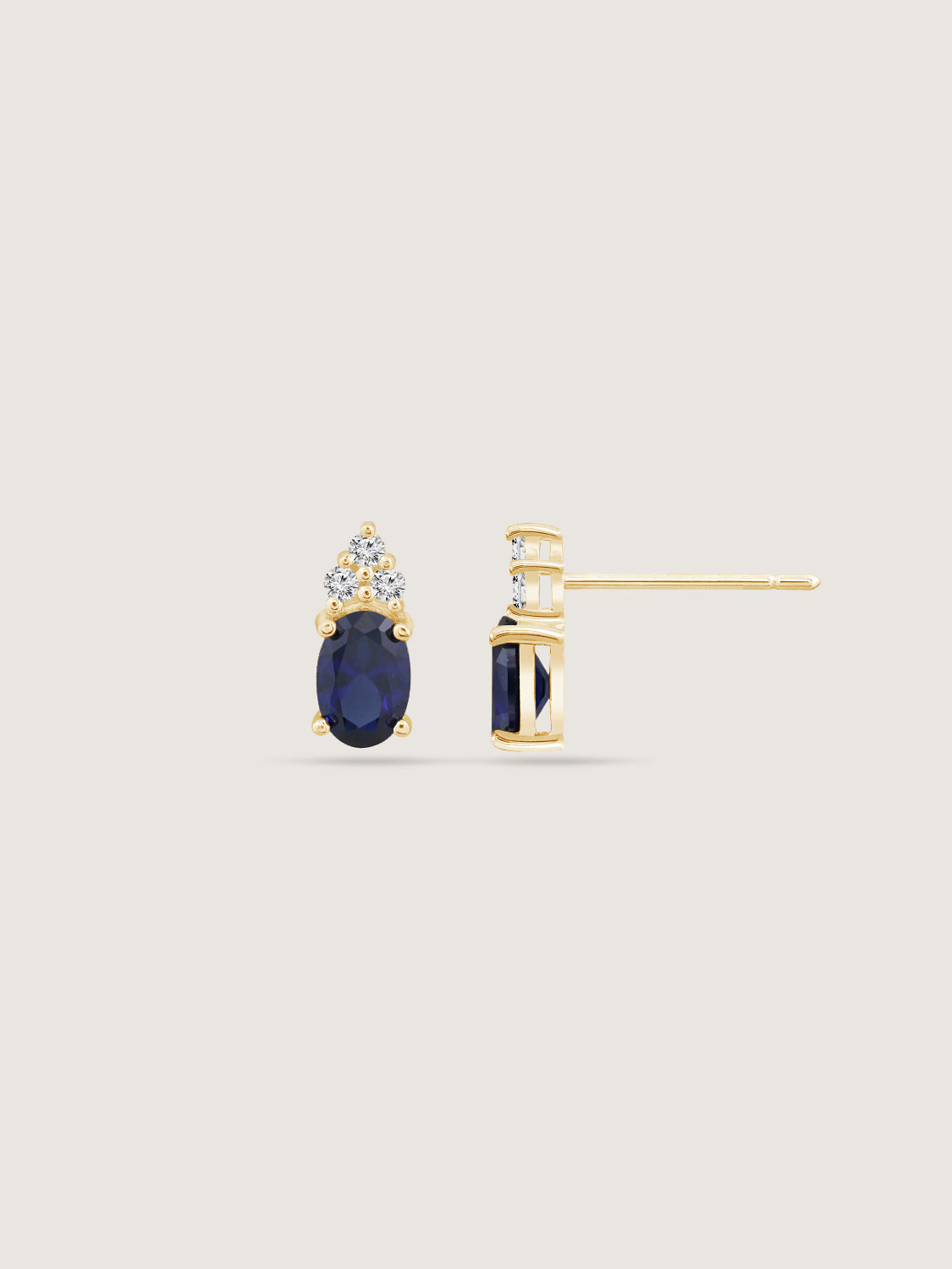 Oval Cut Created Sapphire With Trio Lab Grown Diamond Accent Stud Earrings