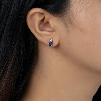 Oval Cut Created Sapphire With Trio Lab Grown Diamond Accent Stud Earrings