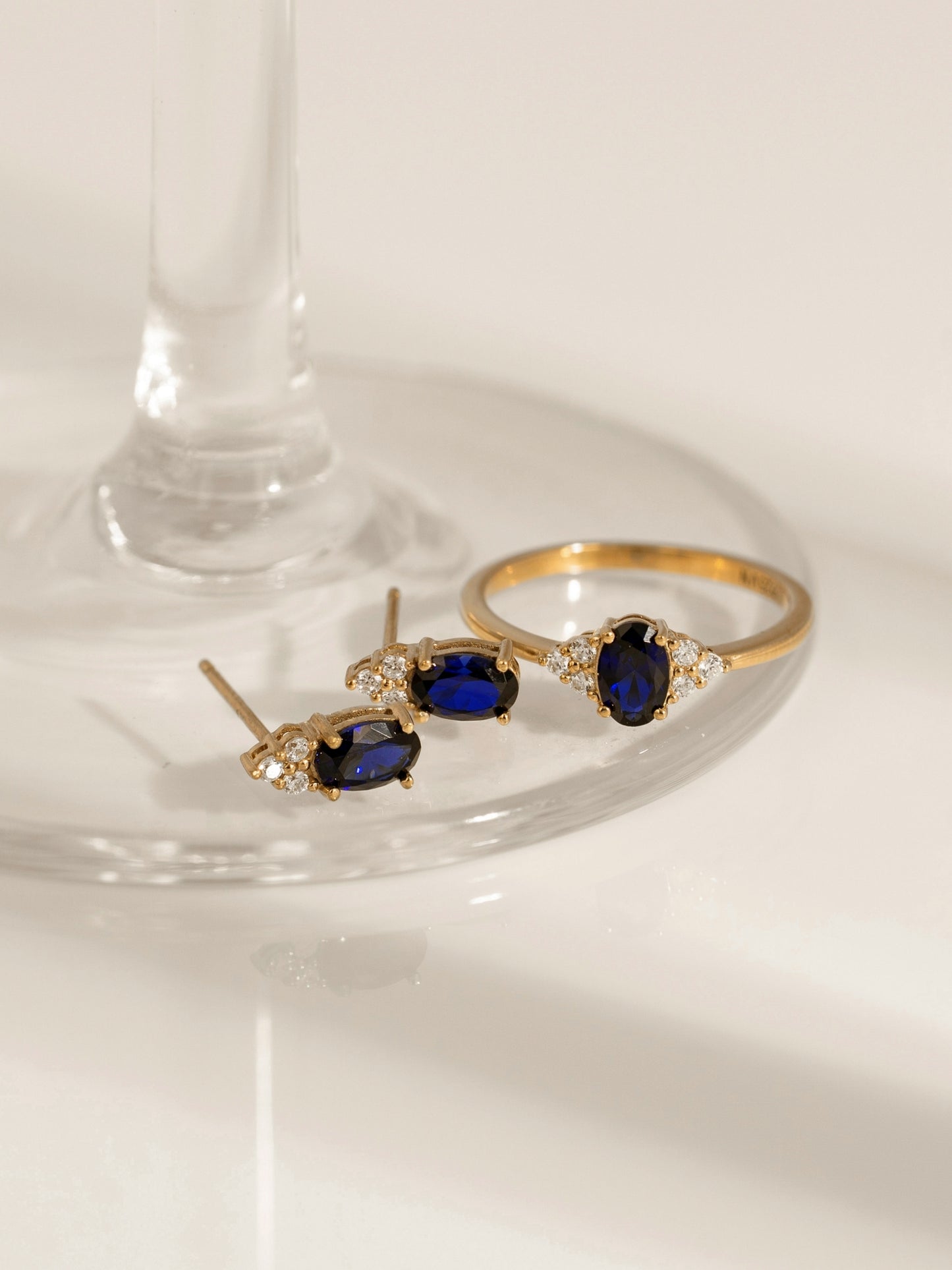Oval Cut Created Sapphire With Trio Lab Grown Diamond Accent Stud Earrings