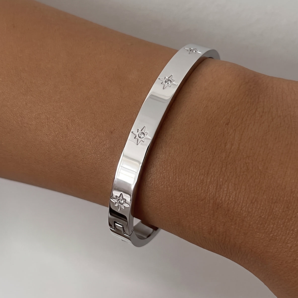 Aquabliss Silver-Tone Stainless Steel Celestial Star Cubic Zirconia Hinged Bangle Bracelet