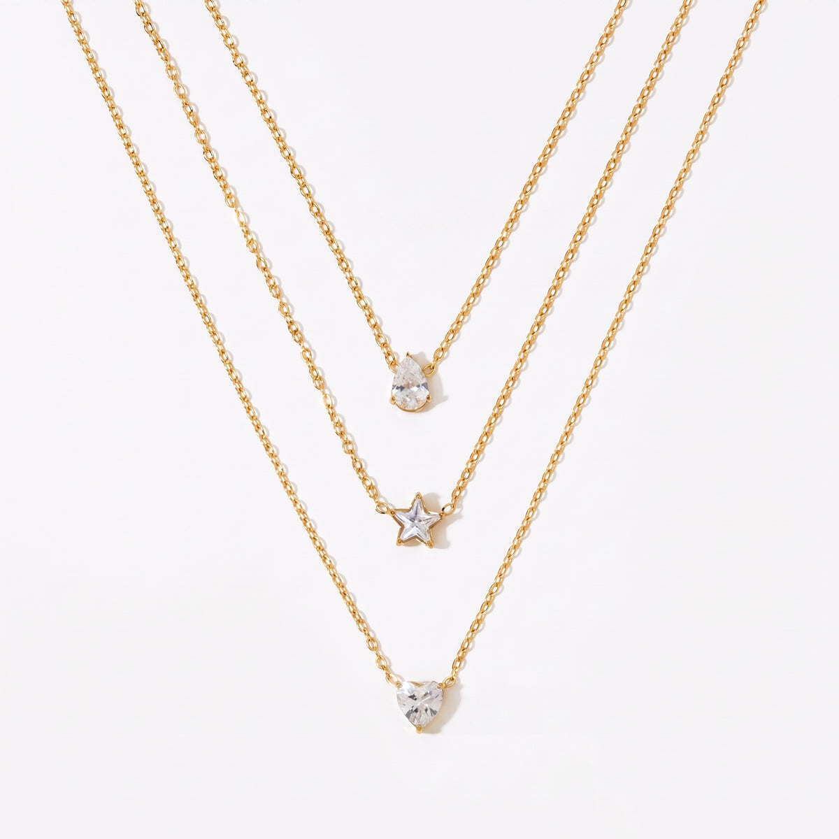 Aquabliss Triple Layer Gold-Tone Stainless Steel Necklace with Teardrop, Star, and Heart Pendants