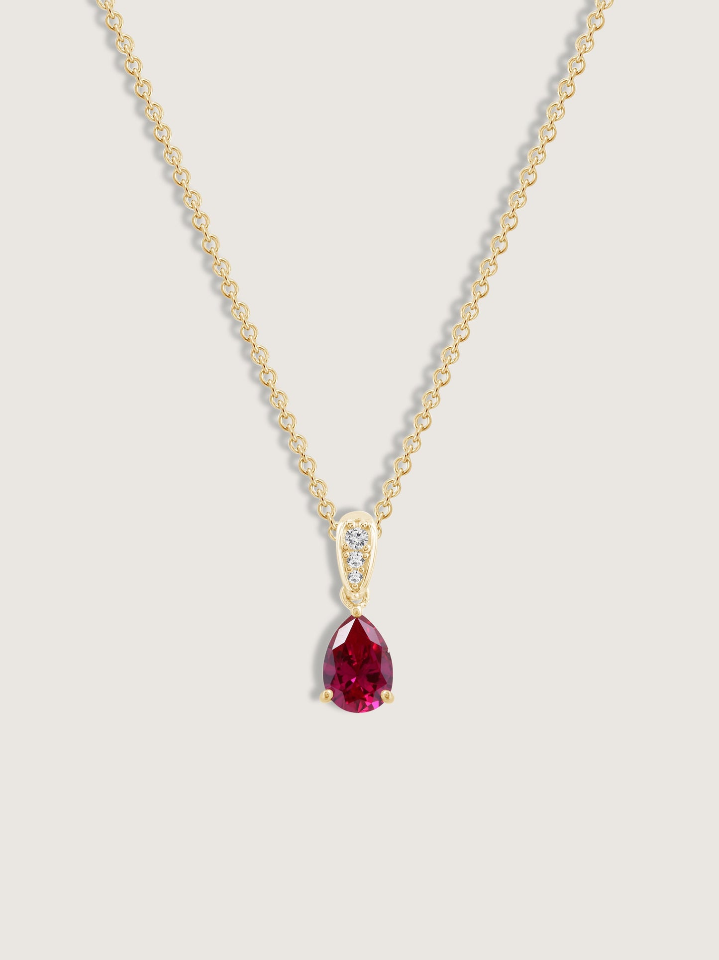 Pear Cut Created Ruby With Lab Grown Diamond Accent Pendant Necklace
