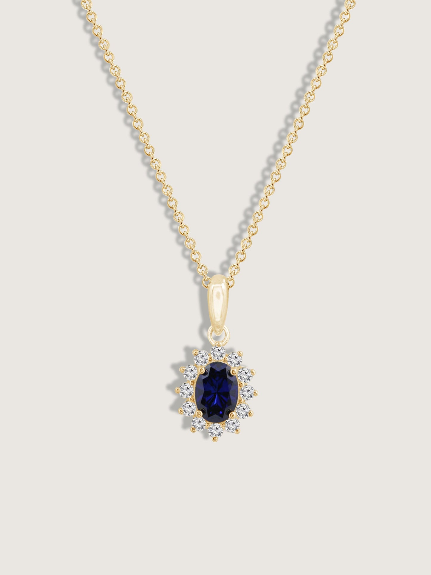 Oval Cut Created Sapphire With Lab Grown Diamond Accent Halo Pendant Necklace