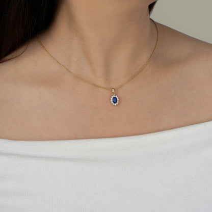 Oval Cut Created Sapphire With Lab Grown Diamond Accent Halo Pendant Necklace