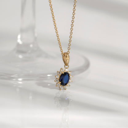 Oval Cut Created Sapphire With Lab Grown Diamond Accent Halo Pendant Necklace