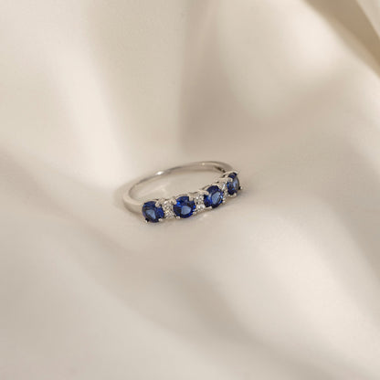 4mm Round Cut Created Sapphire With Lab Grown Diamond Accent Half Band Ring