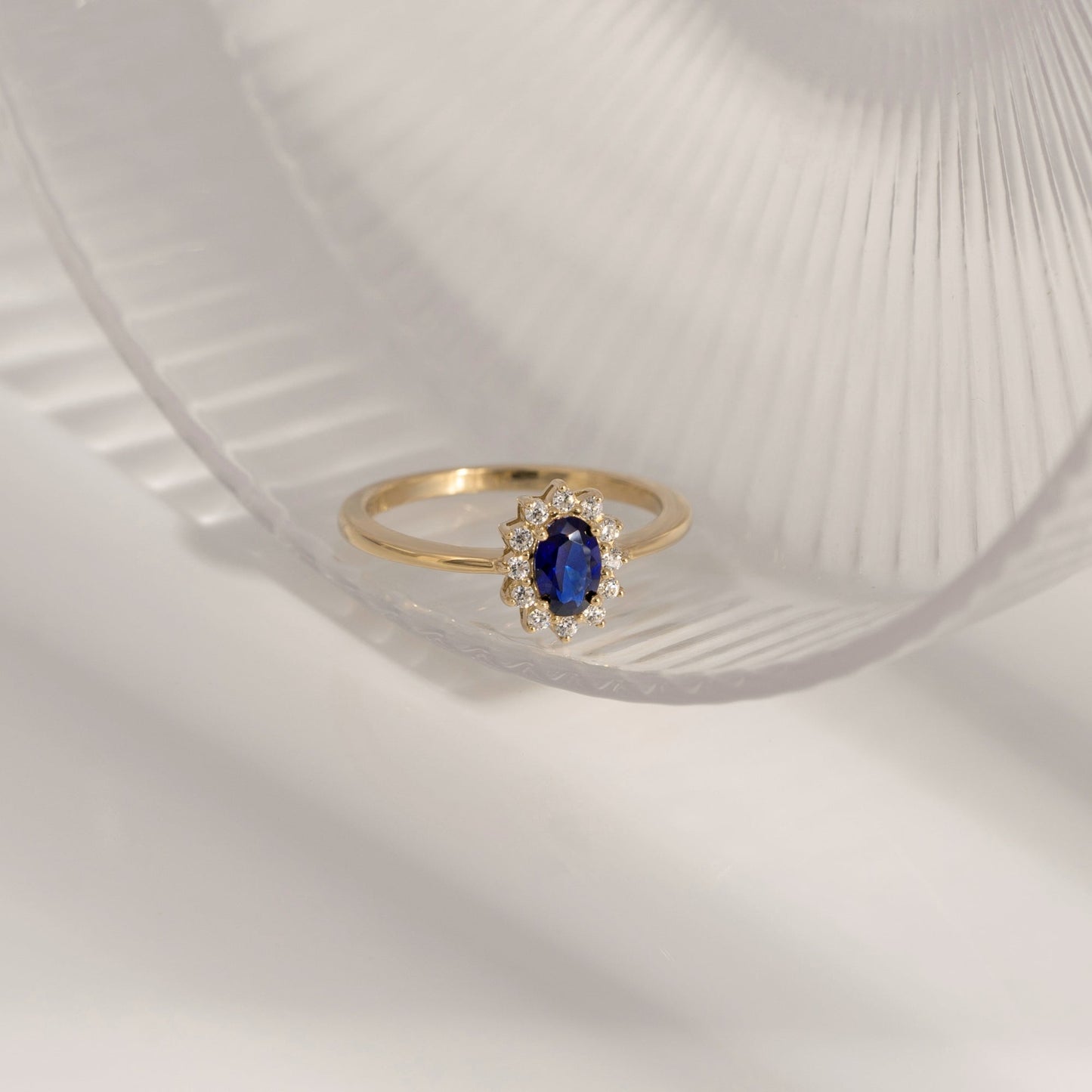 Oval Cut Created Sapphire With Lab Grown Diamond Accent Halo Ring