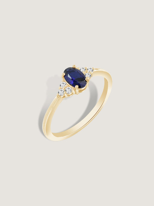 Oval Cut Created Sapphire With Trio Lab Grown Diamond On Shank Engagement Ring