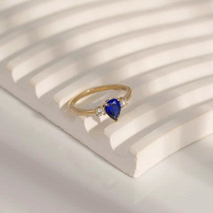 Pear Cut Created Sapphire And Lab Grown Diamond Three Stones Ring